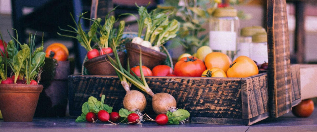 food basket in a market containing vegetables